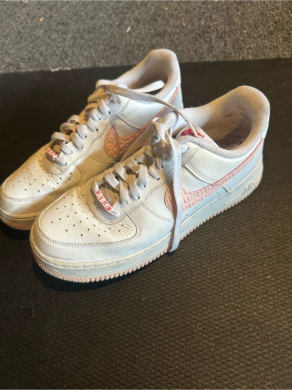 Nike Women’s White and Light Pink Air Force 1 Sneakers